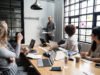 No-Code Stack for B2C App Landing Pages Group of diverse people having a business meeting
