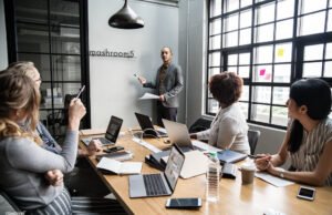 No-Code Stack for B2C App Landing Pages Group of diverse people having a business meeting