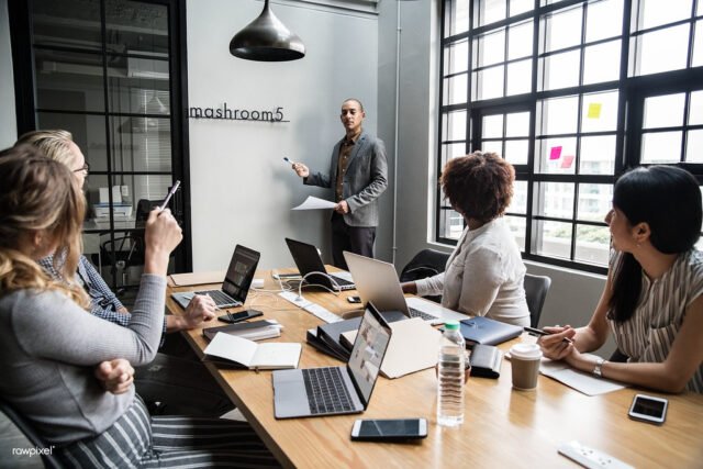 No-Code Stack for B2C App Landing Pages Group of diverse people having a business meeting