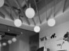 How to Hire a Webflow Designer in 2026: Costs, Where to Look, and How to Vet Minimalist workspace with a large screen, tripods, web design graphics, and pendant lights.